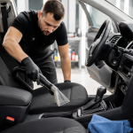Professional interior car detailing and odor elimination service inside a vehicle