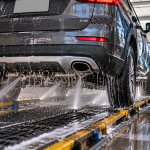 Underbody car wash cleaning salt and road grime beneath a vehicle